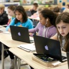 Caitlyn Yaede, 10, right,  works on her fifth-grade science lesson at East Mooresville Intermediate School.